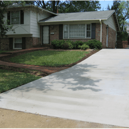 A 100 square foot concrete driveway and sidewalk