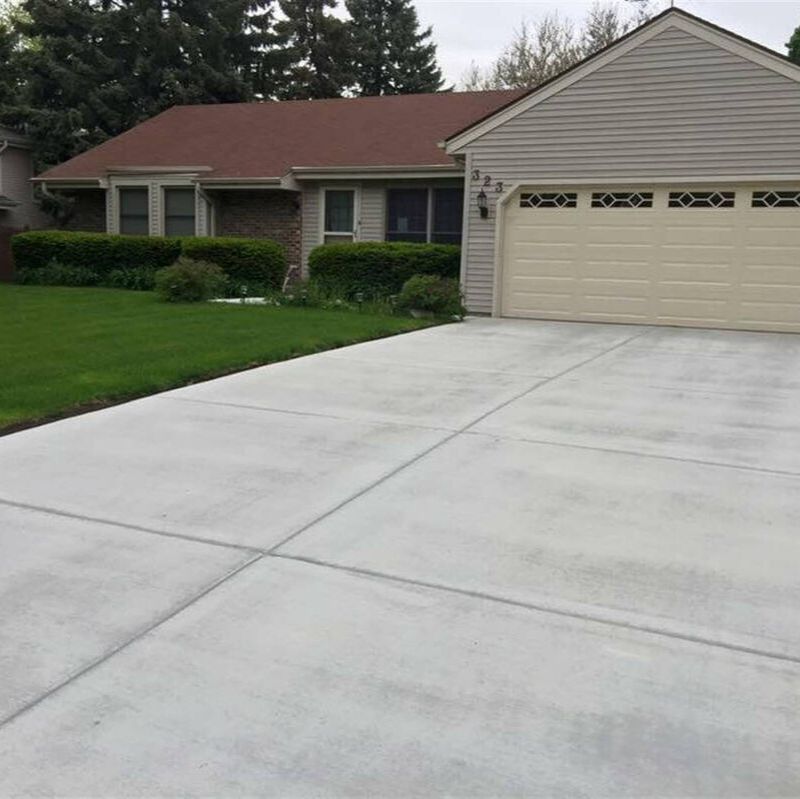 A large concrete driveway and sidewalk