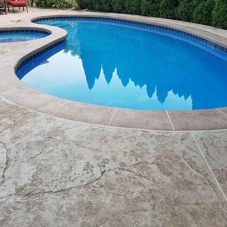 A stamped concrete pool deck